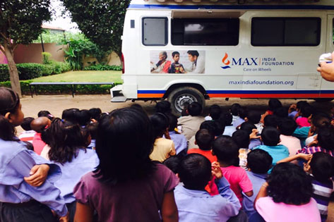 Children watching Film on Hand-washing at our Mobile Health Van Screen