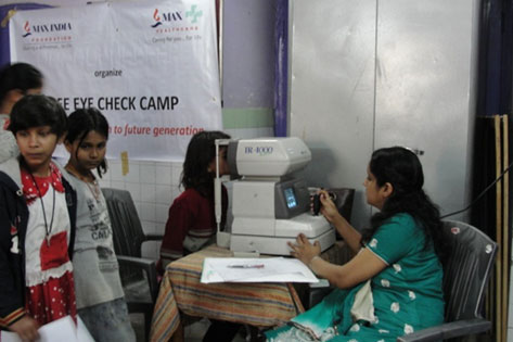Eye check up at a multispecialty health camp conducted at Umeed Home
